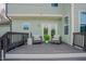 Relaxing back deck with outdoor seating and decorative elements at 416 Granite Saddle Dr, Rolesville, NC 27571
