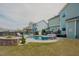 Inviting backyard with a swimming pool, gazebo, and beautifully designed stone planters at 416 Granite Saddle Dr, Rolesville, NC 27571