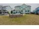 Expansive backyard featuring a stone-lined pool, lush lawn, and neatly manicured landscaping at 416 Granite Saddle Dr, Rolesville, NC 27571