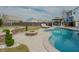 Scenic backyard with a refreshing pool, fire pit, and lush landscaping perfect for relaxation at 416 Granite Saddle Dr, Rolesville, NC 27571