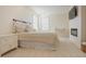 Bedroom with carpet flooring, windows with blinds, and fireplace at 416 Granite Saddle Dr, Rolesville, NC 27571