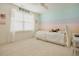 Bedroom featuring carpet flooring, large window with blinds, and a colorful striped accent wall at 416 Granite Saddle Dr, Rolesville, NC 27571