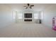 Large bonus room with multiple windows, TV, and ceiling fan at 416 Granite Saddle Dr, Rolesville, NC 27571