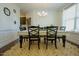 Bright dining area featuring an area rug, white walls, and a modern chandelier at 416 Granite Saddle Dr, Rolesville, NC 27571