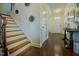 Spacious home entryway featuring hardwood floors, a staircase, and neutral paint at 416 Granite Saddle Dr, Rolesville, NC 27571