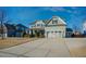 Charming two-story home with a well-manicured lawn, long driveway, and inviting curb appeal on a sunny day at 416 Granite Saddle Dr, Rolesville, NC 27571
