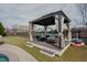 Covered gazebo with comfortable lounge seating on a wooden deck at 416 Granite Saddle Dr, Rolesville, NC 27571