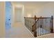 Upstairs hallway with decorative railing and neutral paint color at 416 Granite Saddle Dr, Rolesville, NC 27571