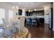 Kitchen and breakfast area with a small table, white chairs, and dark cabinets at 416 Granite Saddle Dr, Rolesville, NC 27571