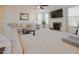 Spacious living room featuring a fireplace, a large TV, and neutral decor at 416 Granite Saddle Dr, Rolesville, NC 27571