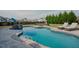 Inviting pool area surrounded by lush landscaping and lounge chairs at 416 Granite Saddle Dr, Rolesville, NC 27571