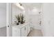 Bathroom with a dual sink vanity, large mirror, modern lighting, and white bathtub at 4405 Emeline Way # 8, Fuquay Varina, NC 27526