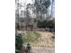 View of a fenced in backyard with partial grass at 468 Talons Rest Way, Cary, NC 27513