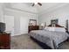 Bright and roomy bedroom features plush carpet, tray ceiling, and ceiling fan at 468 Talons Rest Way, Cary, NC 27513