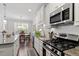 Bright kitchen with stainless steel appliances, granite countertops, and a breakfast nook at 468 Talons Rest Way, Cary, NC 27513