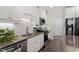Well-equipped kitchen with stainless appliances, granite counters and white tile backsplash at 468 Talons Rest Way, Cary, NC 27513