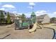 Community playground with slides, climbing structures, and a safe, wood-chip surface at 468 Talons Rest Way, Cary, NC 27513