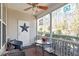 Charming screened porch with seating, a table, and a decorative star on the door at 468 Talons Rest Way, Cary, NC 27513