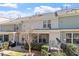 Back of the home features a patio, screened in porch and neutral siding at 468 Talons Rest Way, Cary, NC 27513