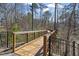 Scenic wooden walkway surrounded by lush trees and greenery, offering a peaceful and inviting outdoor experience at 468 Talons Rest Way, Cary, NC 27513