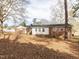 View of the backyard of this home, with trees at 4704 Upchurch Ln, Wake Forest, NC 27587