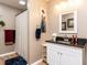 Bathroom featuring granite counters, framed mirror, vanity, and shower with curtain at 4704 Upchurch Ln, Wake Forest, NC 27587