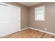 Cozy bedroom features wood floors, ample closet space, and a bright window at 4704 Upchurch Ln, Wake Forest, NC 27587