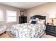 Comfortable bedroom with wood floors, natural light, and stylish furnishings at 4704 Upchurch Ln, Wake Forest, NC 27587