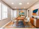 Tastefully decorated dining room featuring a modern table, chairs, and stylish artwork at 4704 Upchurch Ln, Wake Forest, NC 27587