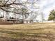 Charming brick home with a well-maintained lawn and detached garage at 4704 Upchurch Ln, Wake Forest, NC 27587