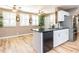 Updated kitchen featuring stainless steel appliances, granite countertops, and custom cabinetry at 4704 Upchurch Ln, Wake Forest, NC 27587