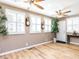 Inviting living area with wood floors, plenty of natural light, and ceiling fans at 4704 Upchurch Ln, Wake Forest, NC 27587