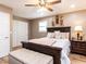 Relaxing main bedroom with ensuite bathroom, wood floors, ceiling fan, and neutral decor at 4704 Upchurch Ln, Wake Forest, NC 27587