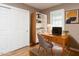 Versatile office with wood floors, closet, natural light, desk, and shelving at 4704 Upchurch Ln, Wake Forest, NC 27587