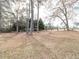 Exterior view of a large property featuring a combination of trees at 4704 Upchurch Ln, Wake Forest, NC 27587