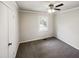 Bedroom with gray carpet, neutral walls, ceiling fan and a window at 5614 Greenbay Dr, Durham, NC 27712