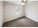 This is a bedroom with painted walls, a ceiling fan, a window, and carpet flooring at 5614 Greenbay Dr, Durham, NC 27712