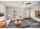 Bright living room with neutral decor, a large window, stylish furniture, and ample natural light at 5614 Greenbay Dr, Durham, NC 27712