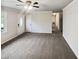 Living room featuring a large window and carpet flooring at 5614 Greenbay Dr, Durham, NC 27712