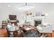 Comfortable living room featuring hardwood floors, stylish seating, and a classic fireplace at 701 S Fifth St, Mebane, NC 27302