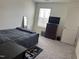 Bedroom with a bed, a dresser, and a mirror at 704 Mirror Pond Dr, Zebulon, NC 27597