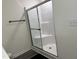 The shower has glass doors at 704 Mirror Pond Dr, Zebulon, NC 27597