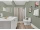Well-lit bathroom with a double vanity sink and modern fixtures at 709 North St, Durham, NC 27701
