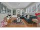 Inviting living room with a plush sofa, hardwood floors, and natural light at 709 North St, Durham, NC 27701