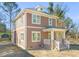Two-story home with craftsman details, a covered front porch, and beautiful architectural details at 717 Heidelberg St, Durham, NC 27704