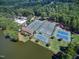 Beautiful community amenities featuring tennis courts and swimming pool next to a lake at 103 Bruce Dr, Cary, NC 27511