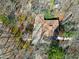 An aerial view of the home surrounded by mature trees and a driveway entrance at 103 Bruce Dr, Cary, NC 27511