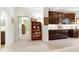 Basement featuring a bookshelf, bar with cabinets, and doorways to other rooms at 103 Bruce Dr, Cary, NC 27511