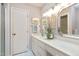 Bathroom featuring a marble countertop, vanity with cabinets and a decorative vase at 103 Bruce Dr, Cary, NC 27511