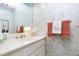 Charming powder room with floral wallpaper, a vanity, and decorative fixtures at 103 Bruce Dr, Cary, NC 27511
